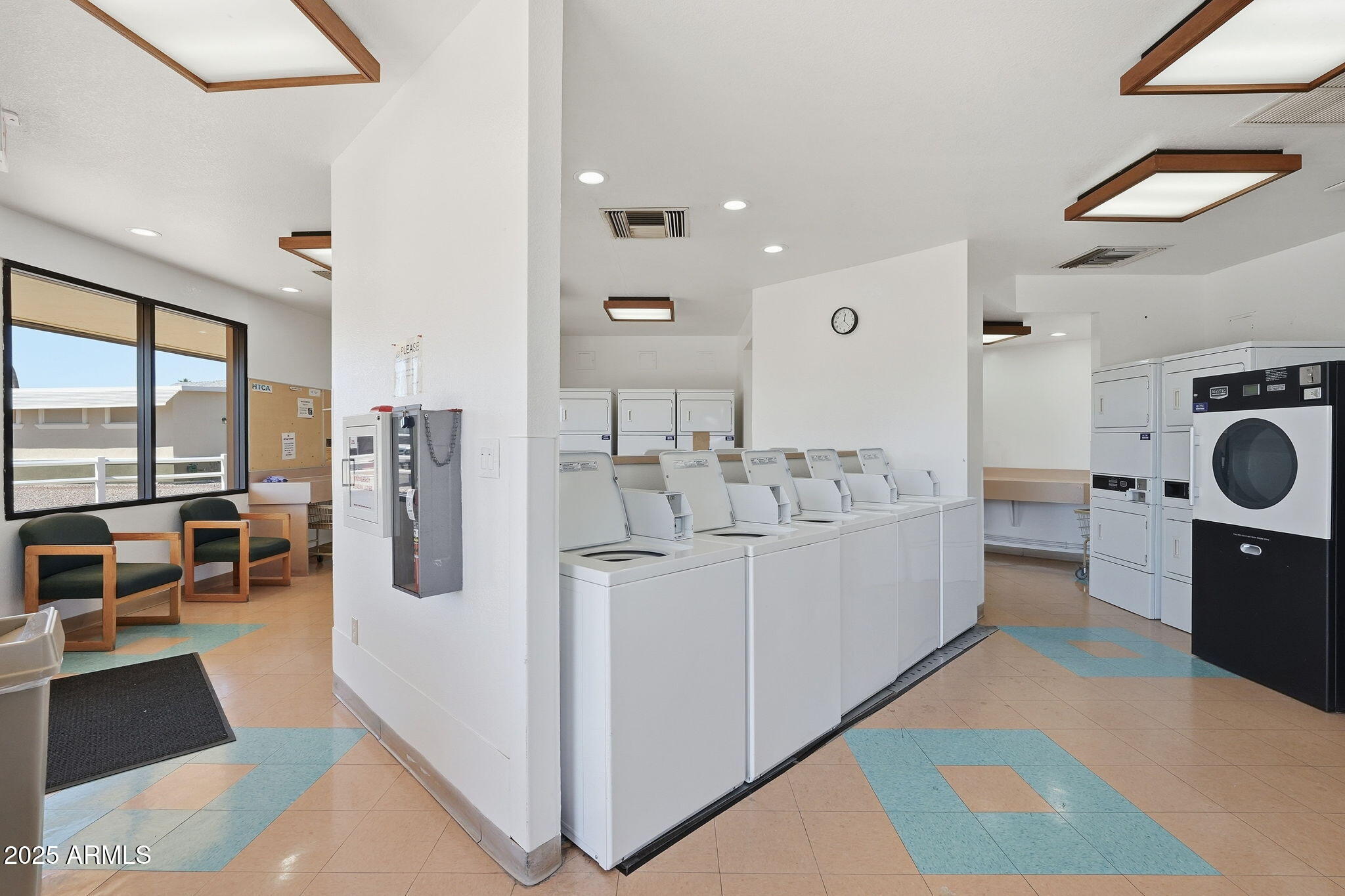 17200 West Bell Road, Unit 1270 Surprise, AZ 85374 - Photo 12 of 15 a large white room with a large window and dryer