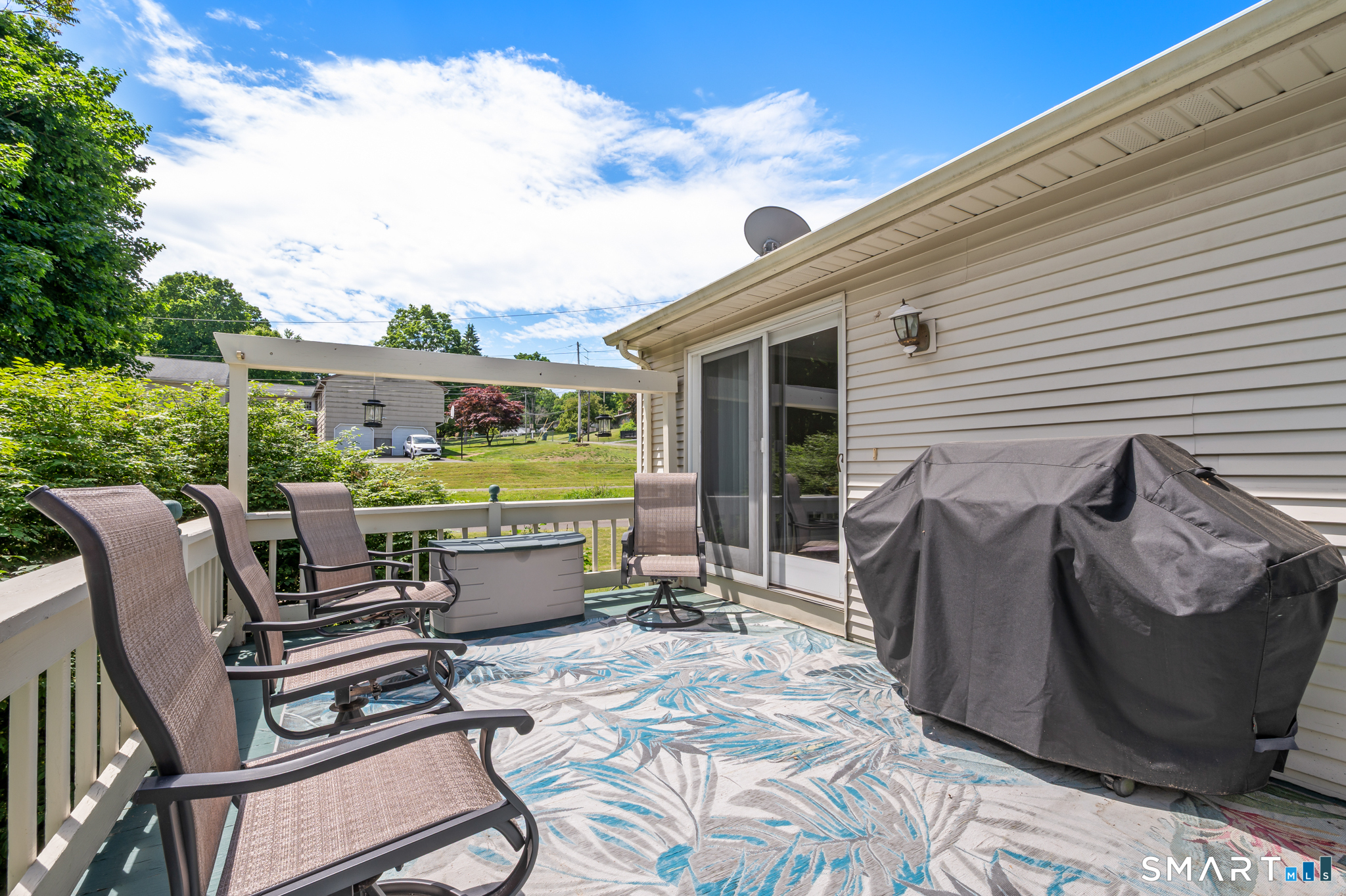 1611 Shepard Avenue Hamden, CT 06518 - Photo 26 of 31 a view of a patio with table and chairs with wooden floor and fence