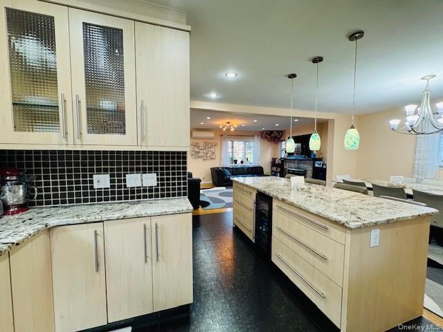 186-22 Avon Road Queens, NY 11432 - Photo 11 of 23 a kitchen with a sink a stove and cabinets