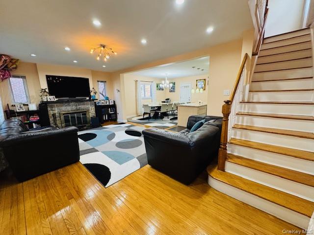 186-22 Avon Road Queens, NY 11432 - Photo 14 of 23 a living room with furniture and a flat screen tv