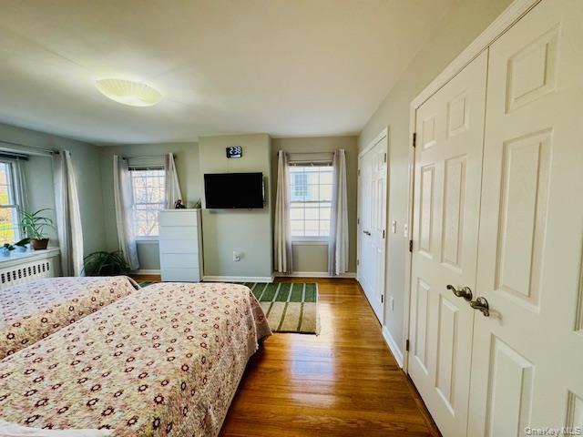 186-22 Avon Road Queens, NY 11432 - Photo 16 of 23 a bedroom with a bed and a flat screen tv