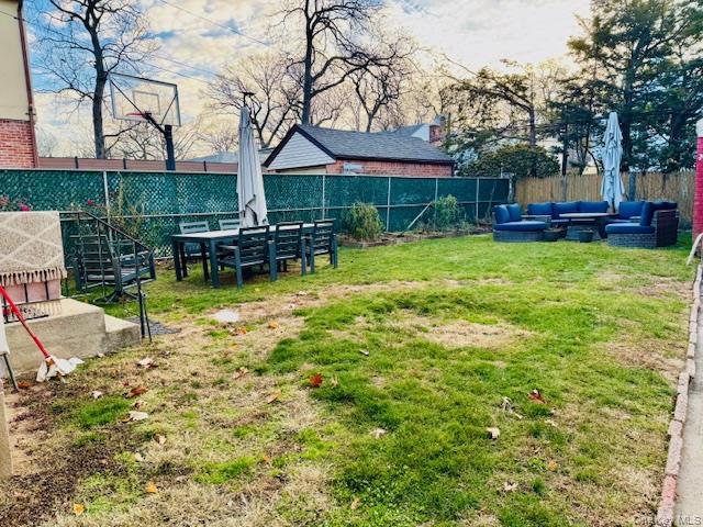 186-22 Avon Road Queens, NY 11432 - Photo 23 of 23 a view of a house with a yard patio and sitting area