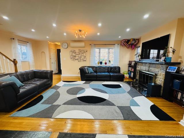 186-22 Avon Road Queens, NY 11432 - Photo 4 of 23 a living room with furniture and a fireplace