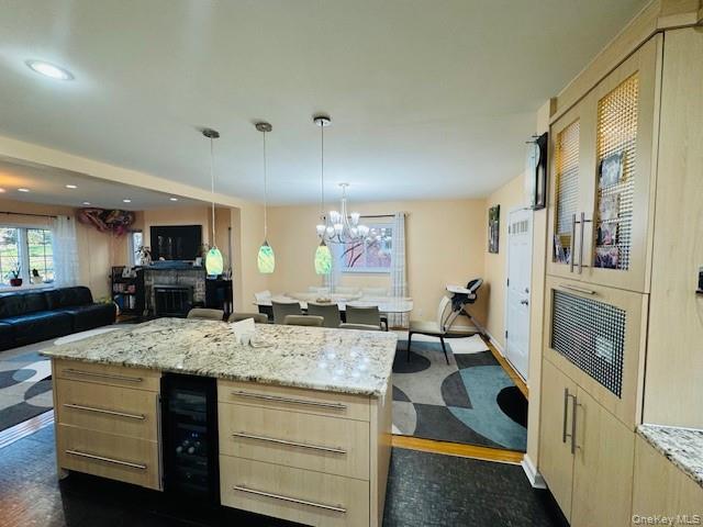 186-22 Avon Road Queens, NY 11432 - Photo 6 of 23 a view of living room kitchen with stainless steel appliances granite countertop cabinets and fireplace