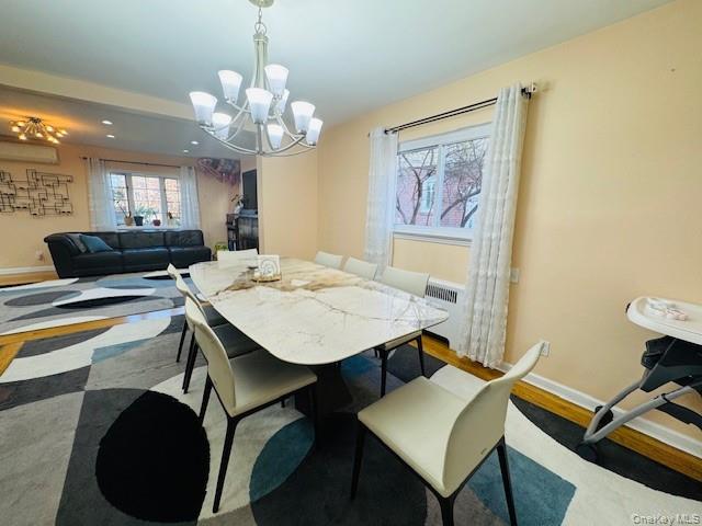 186-22 Avon Road Queens, NY 11432 - Photo 7 of 23 a view of a dining room with furniture and a chandelier