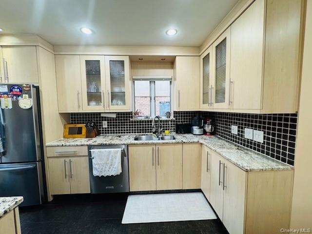 186-22 Avon Road Queens, NY 11432 - Photo 9 of 23 a kitchen with stainless steel appliances granite countertop a sink and cabinets