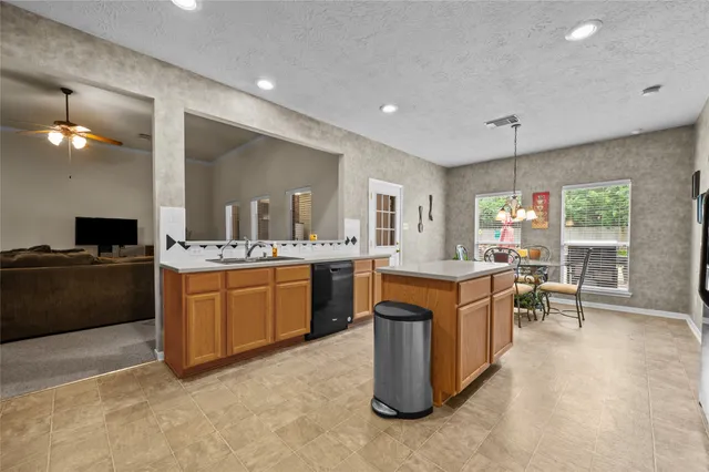 a view of a kitchen counter space and windows