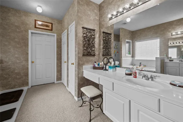 a walk in closet with a couch