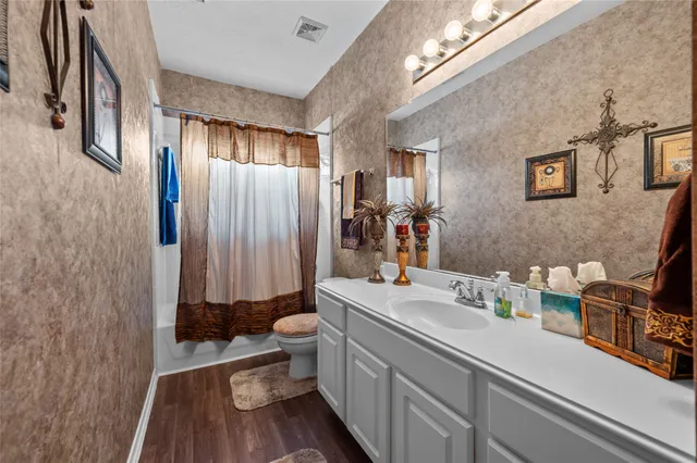 an empty room with bookshelf and wooden shelves