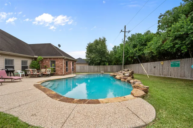 a view of a swimming pool with lounge chair