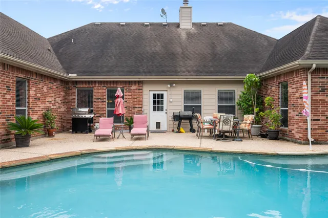 a view of a patio with a table and chairs