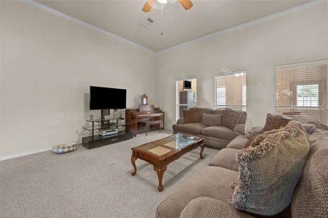 a kitchen with stainless steel appliances kitchen island granite countertop a stove top oven a sink a counter top space and cabinets