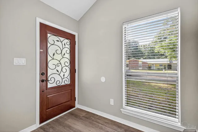 a view of front door with wooden floor