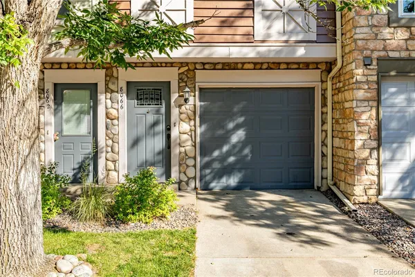 a front view of a house with a garage