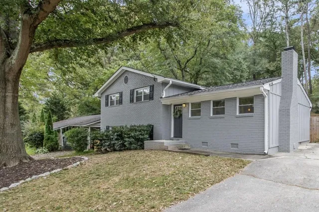 a house with trees in the background
