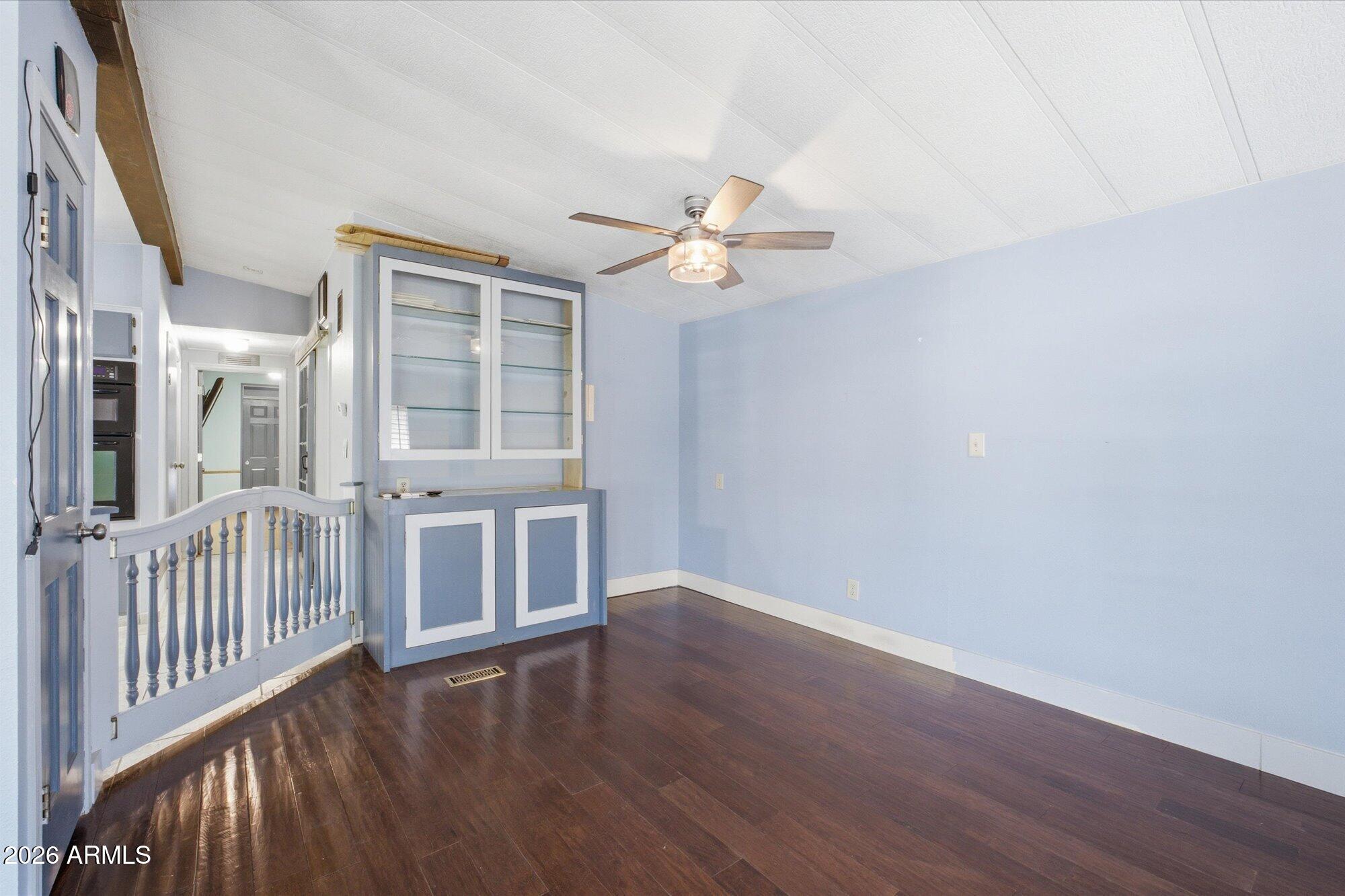 205 South Higley Road, Unit 183 Mesa, AZ 85206 - Photo 18 of 30 wooden floor in an empty room with a window
