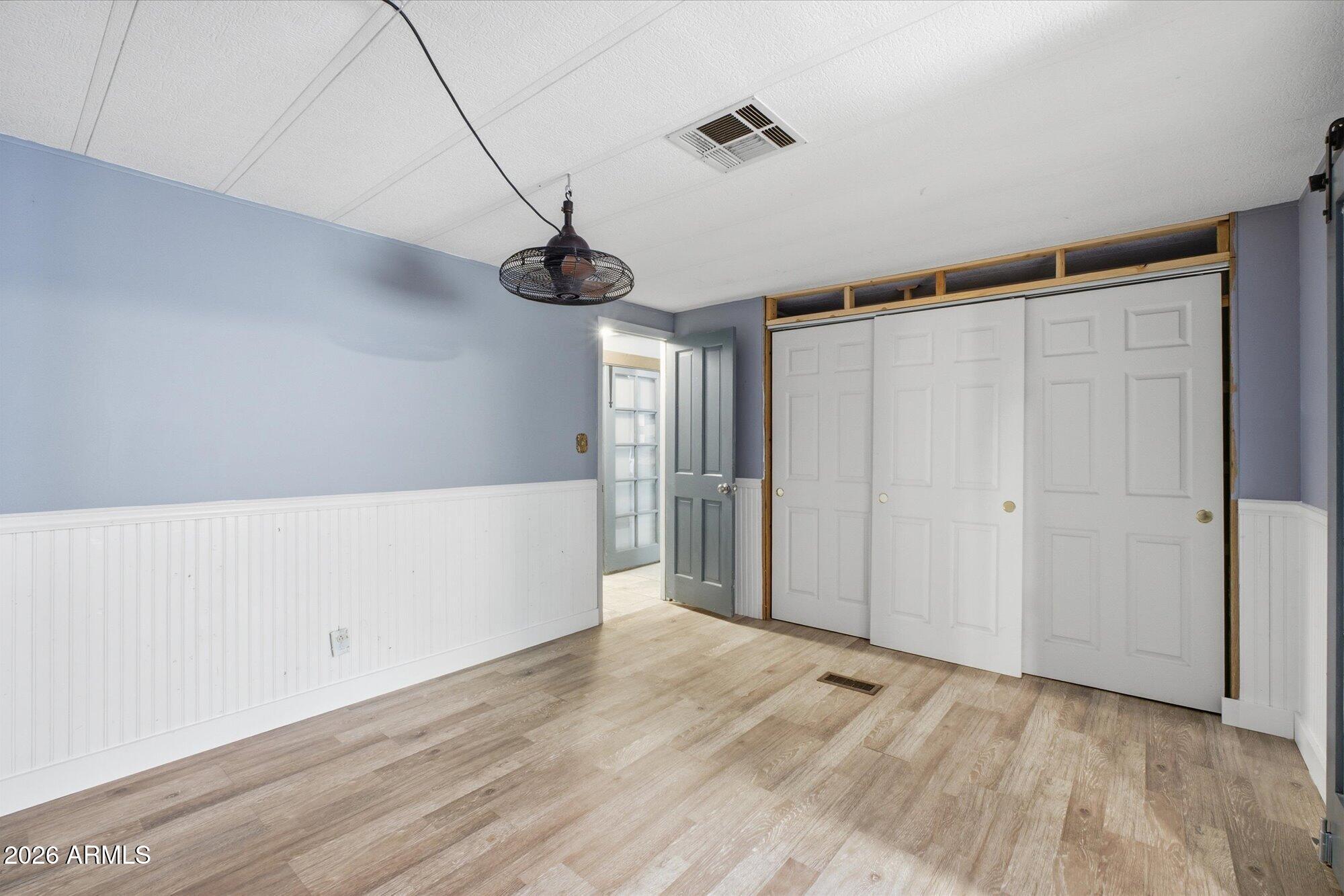 205 South Higley Road, Unit 183 Mesa, AZ 85206 - Photo 20 of 30 a view of empty room with wooden floor