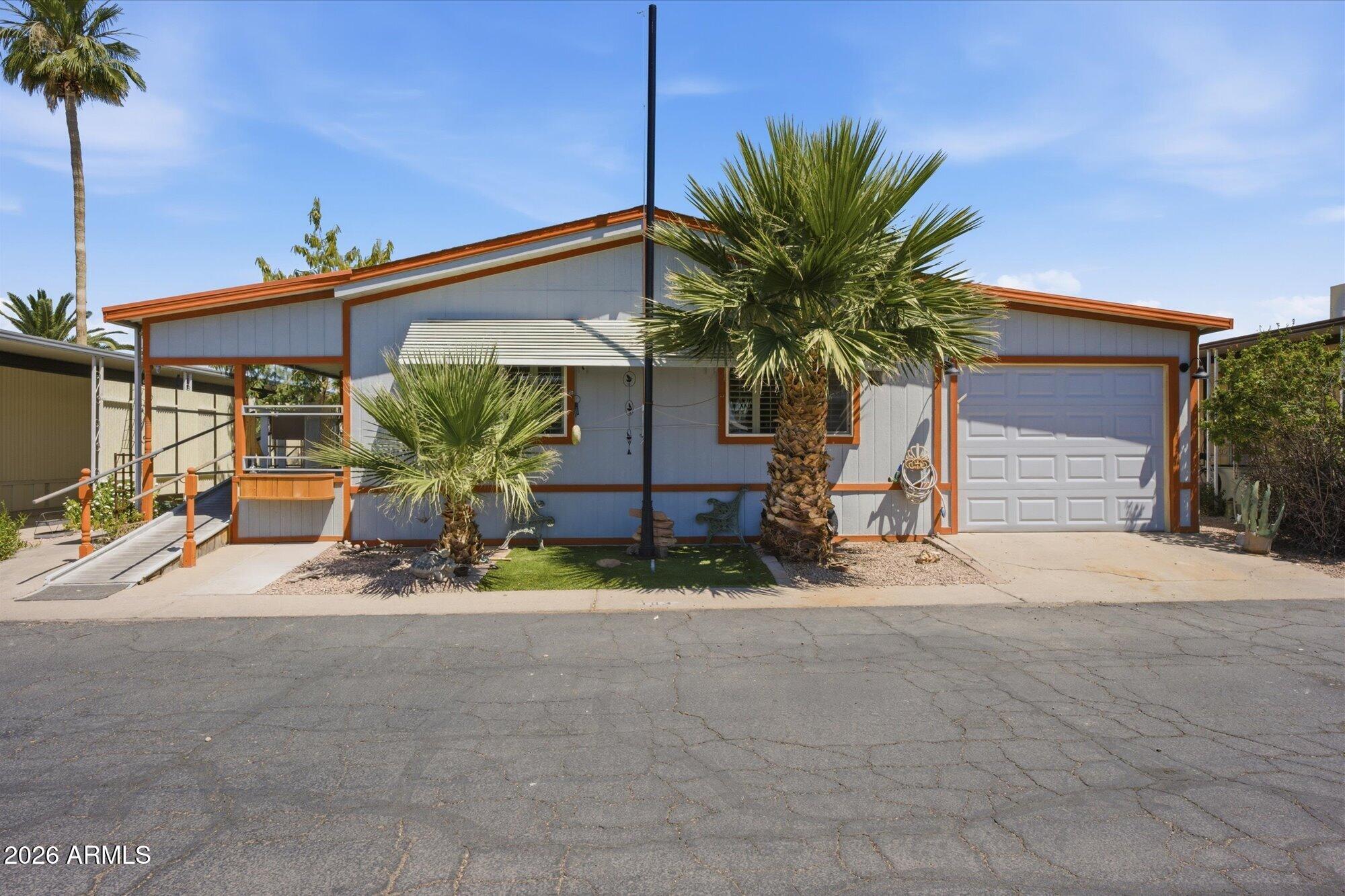 205 South Higley Road, Unit 183 Mesa, AZ 85206 - Photo 2 of 30 a view of a house with a patio