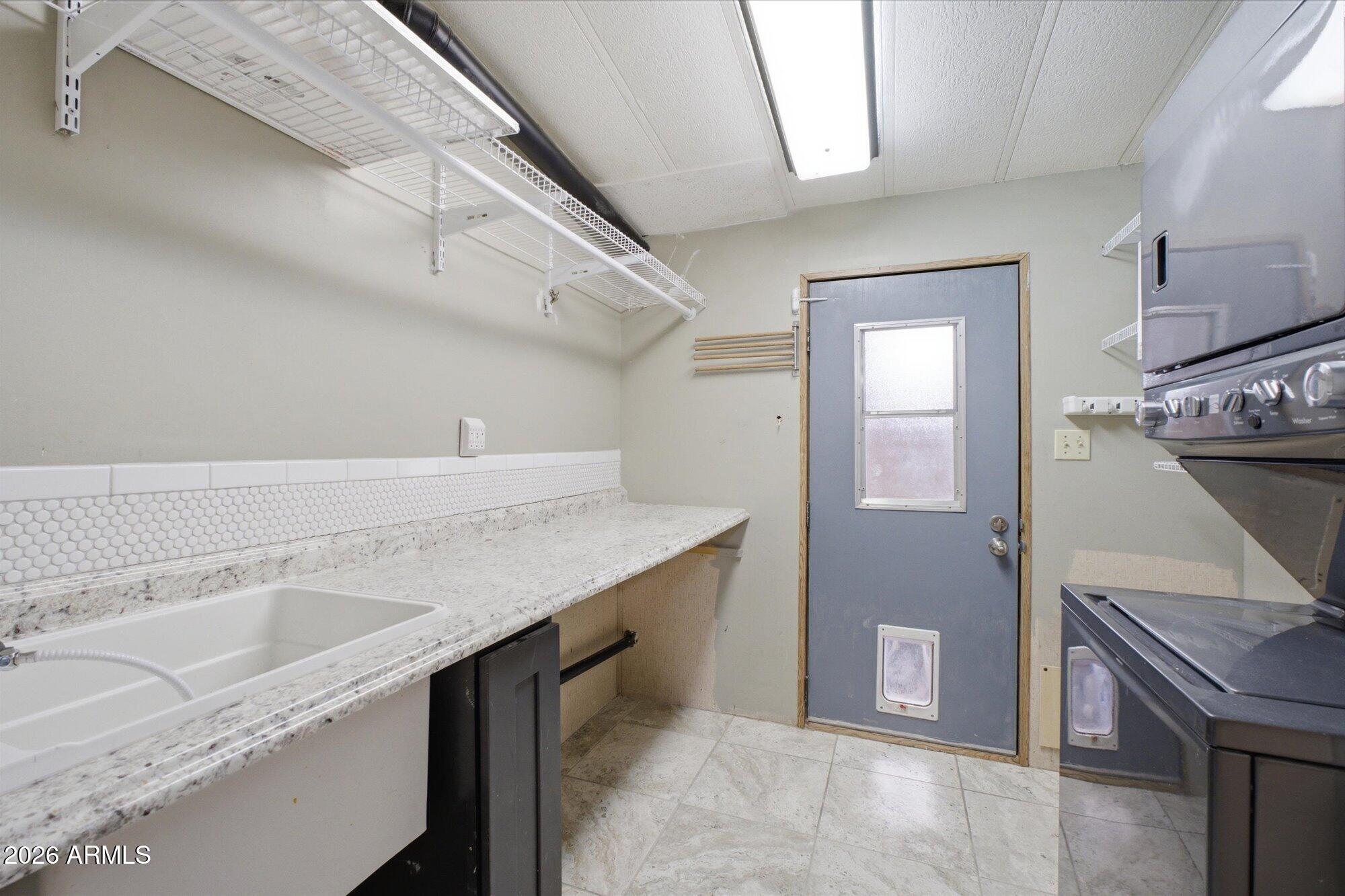 205 South Higley Road, Unit 183 Mesa, AZ 85206 - Photo 23 of 30 a room with a sink cabinets and wooden floor