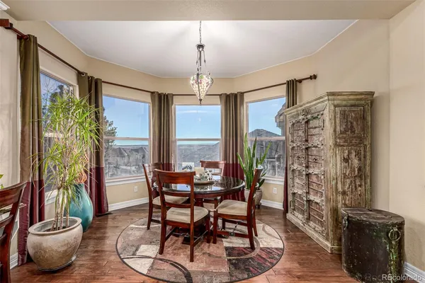 a view of a dining room with furniture window and outside view