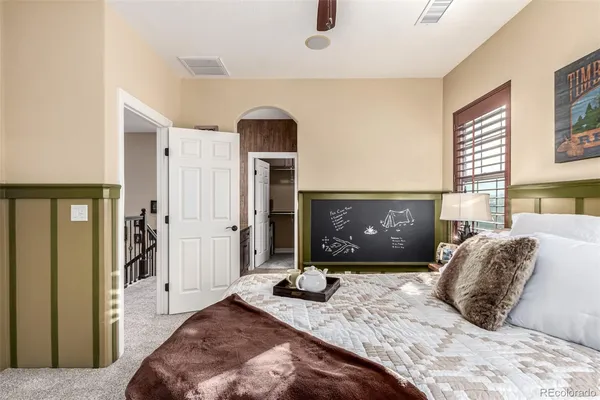 a bedroom with a bed and a fireplace