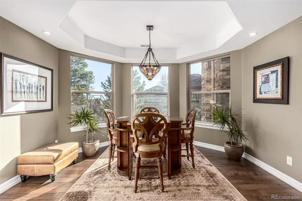 a dining room with furniture window and outside view