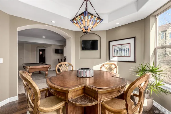a dining room with furniture and window