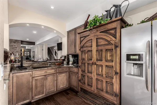 a kitchen with stainless steel appliances a sink and cabinets