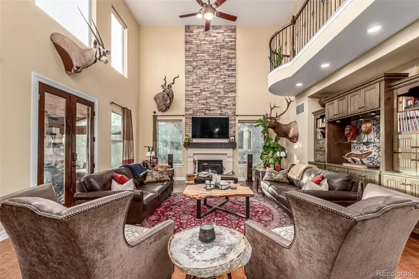a living room with furniture fireplace and flat screen tv