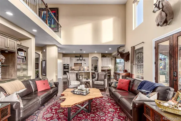 a living room with furniture fireplace and a table