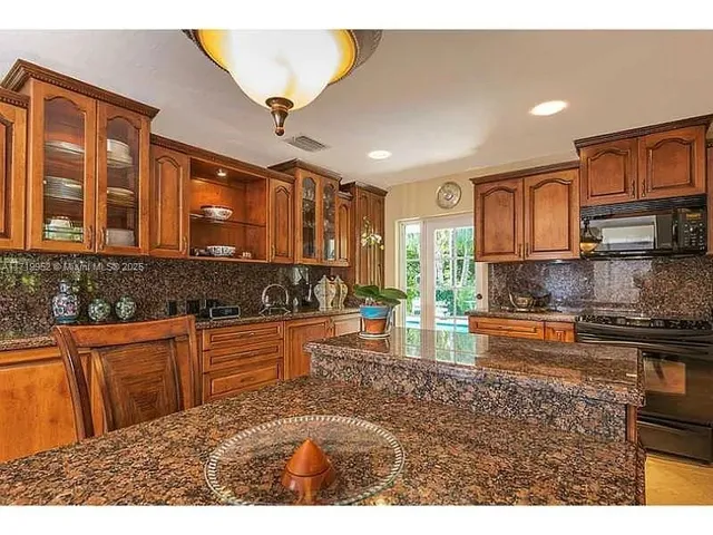 a view of a dining room with furniture and window