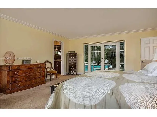 a view of a house with backyard porch and sitting area