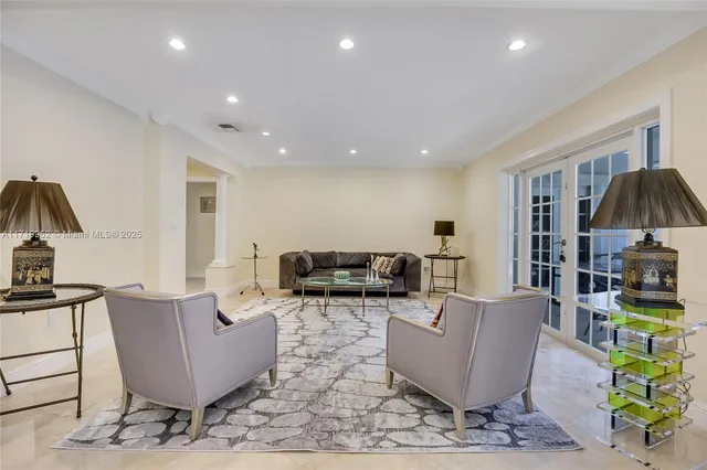 a living room with furniture and a table