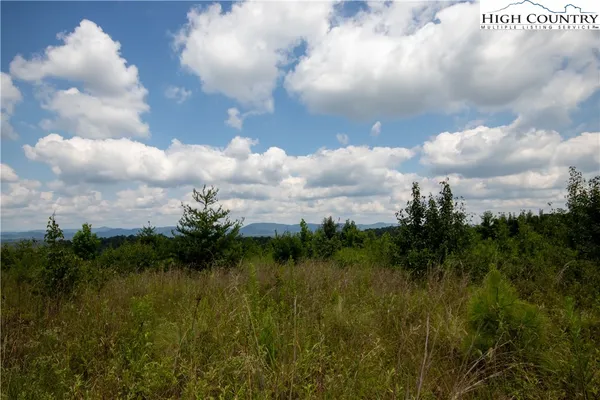 a view of mountain with lake view