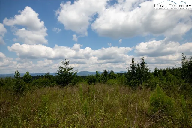 a view of mountain with lake view