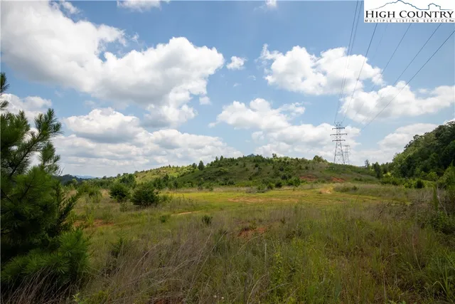 a view of lake with green field