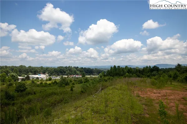 a view of a lake and mountain in the background