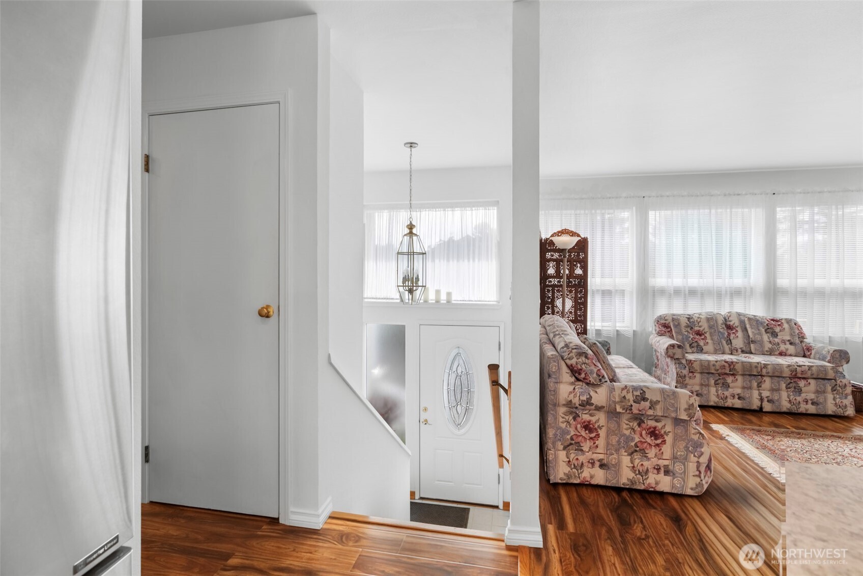 1205 195th Street Long Beach, WA 98631 - Photo 12 of 36 a view of a livingroom with furniture hardwood floor and a ceiling fan