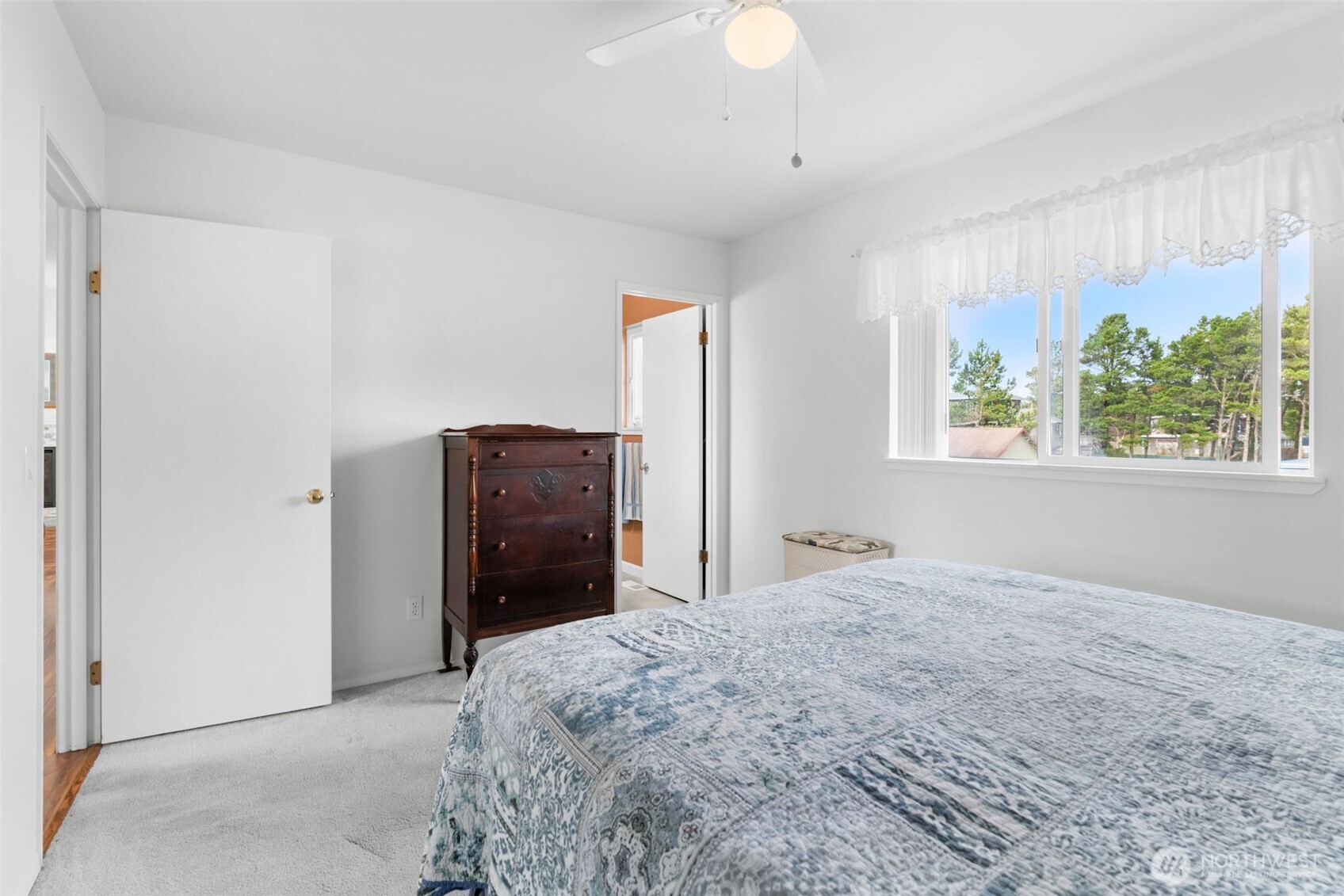 1205 195th Street Long Beach, WA 98631 - Photo 15 of 36 a bedroom with a bed windows and a window