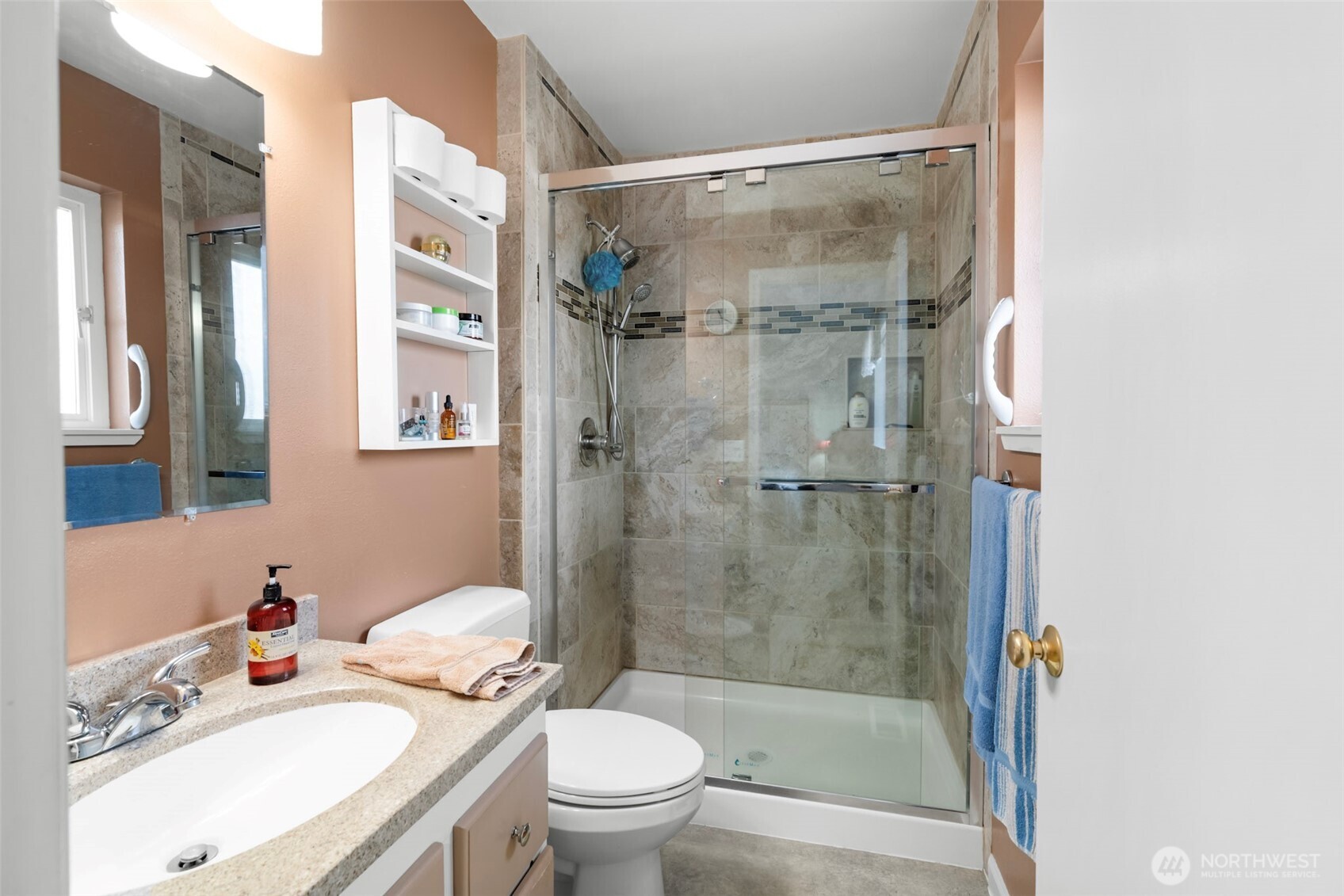 1205 195th Street Long Beach, WA 98631 - Photo 16 of 36 a bathroom with a sink toilet and shower