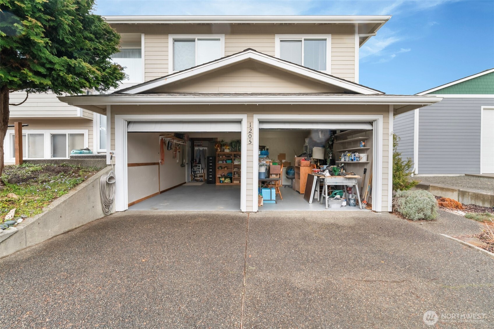 1205 195th Street Long Beach, WA 98631 - Photo 21 of 36 a view of a house with a patio and a yard