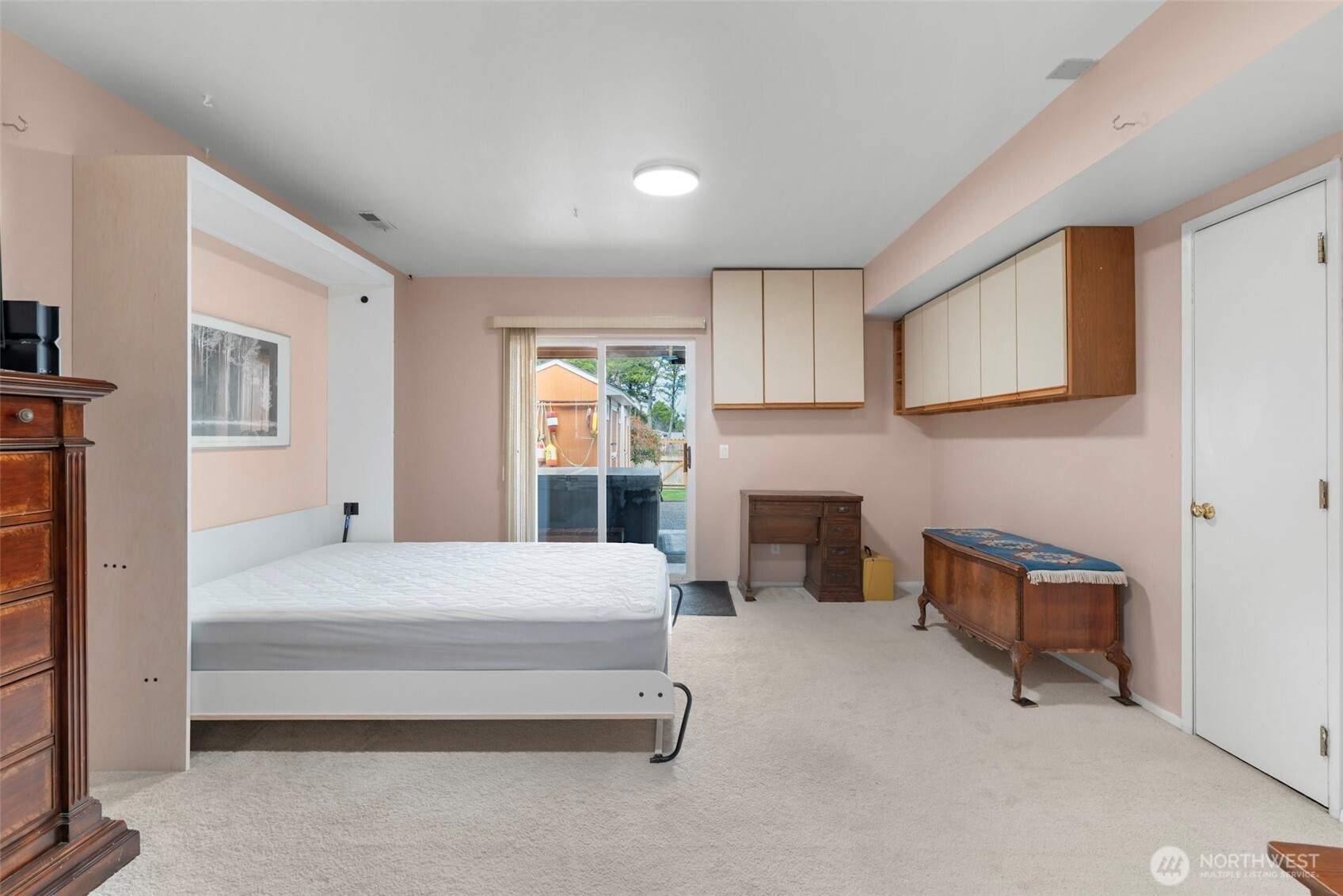 1205 195th Street Long Beach, WA 98631 - Photo 27 of 36 a bedroom with furniture and a fireplace