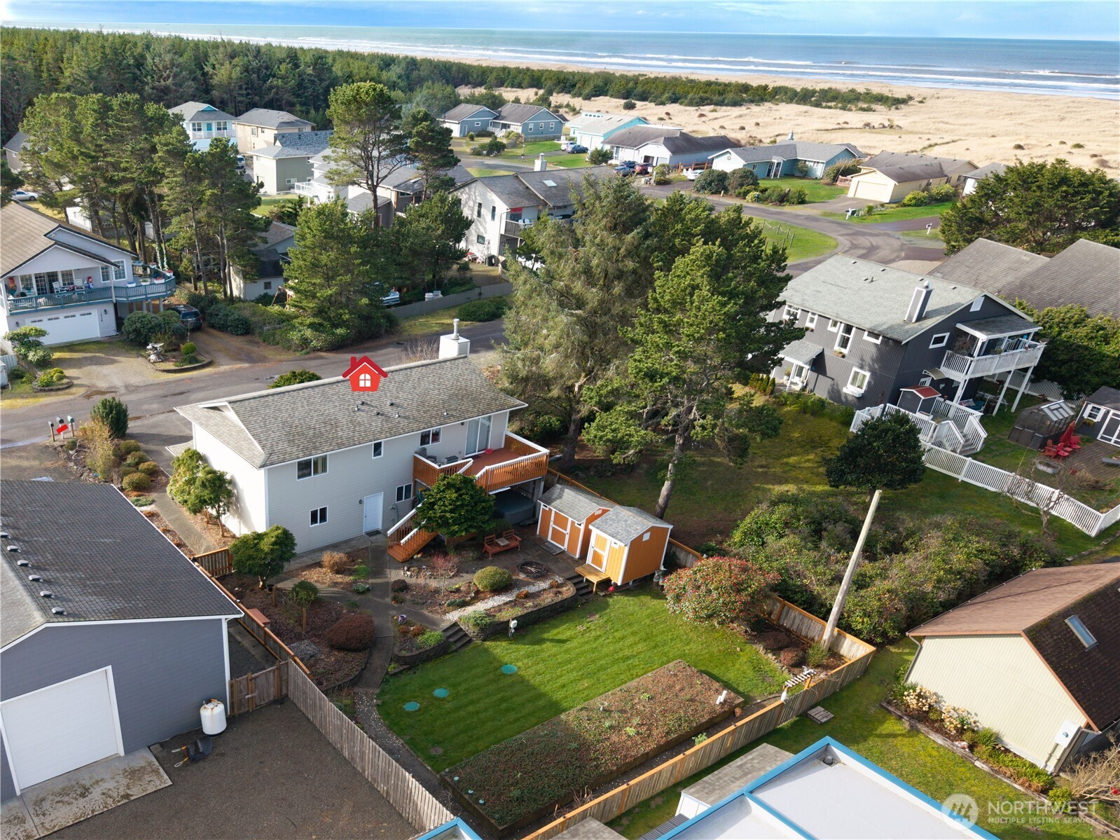 1205 195th Street Long Beach, WA 98631 - Photo 4 of 36 an aerial view of multiple houses with yard