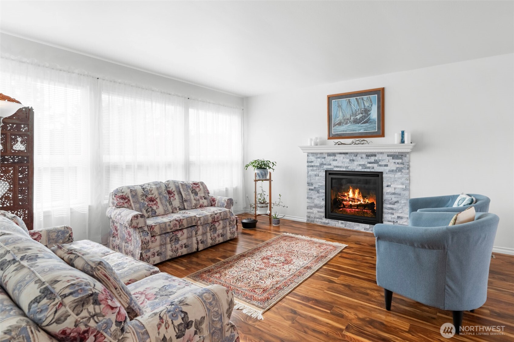 1205 195th Street Long Beach, WA 98631 - Photo 7 of 36 a living room with furniture and a fireplace