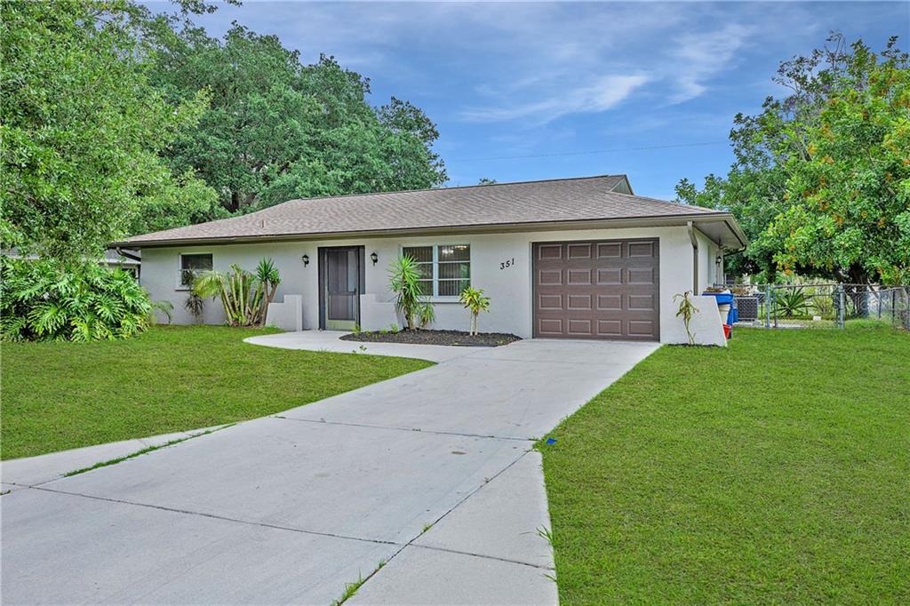 351 Terrapin Road Venice, FL 34293 - Photo 1 of 1 a front view of house with yard and green space