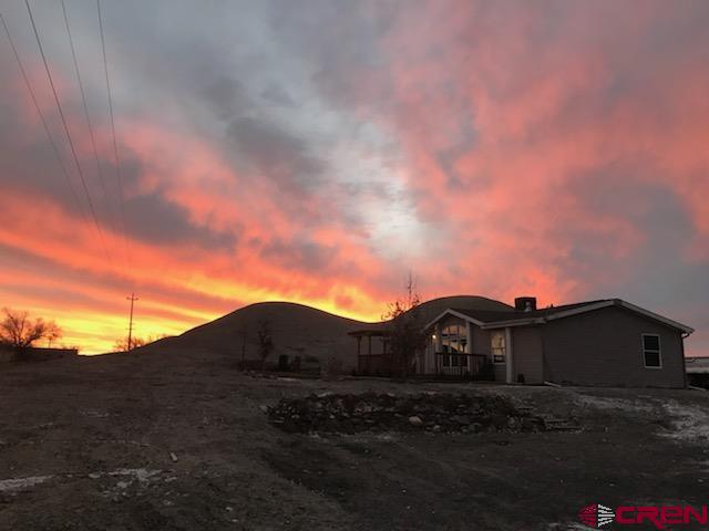 7156 Peach Valley Road Delta, CO 81416 - Photo 13 of 33 a view of a house with a big yard