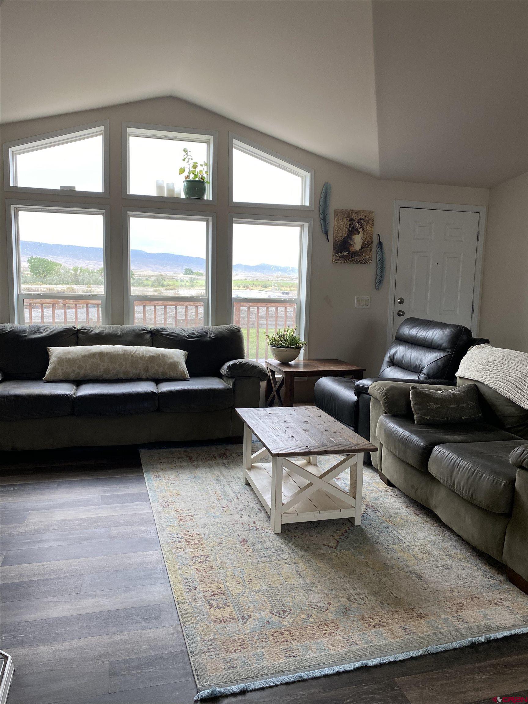 7156 Peach Valley Road Delta, CO 81416 - Photo 15 of 33 a living room with furniture and a large window