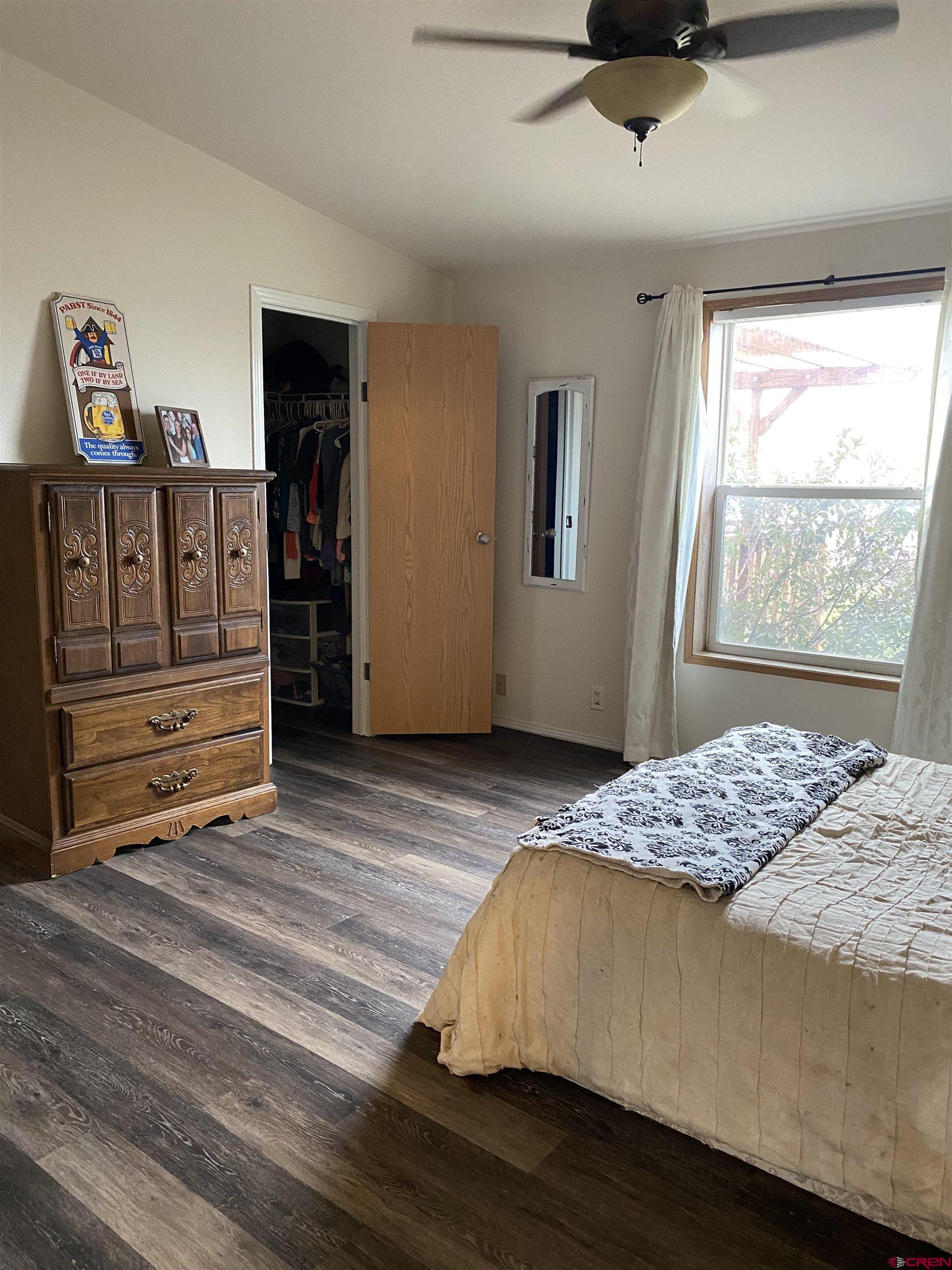 7156 Peach Valley Road Delta, CO 81416 - Photo 23 of 33 a bedroom with a bed and a window