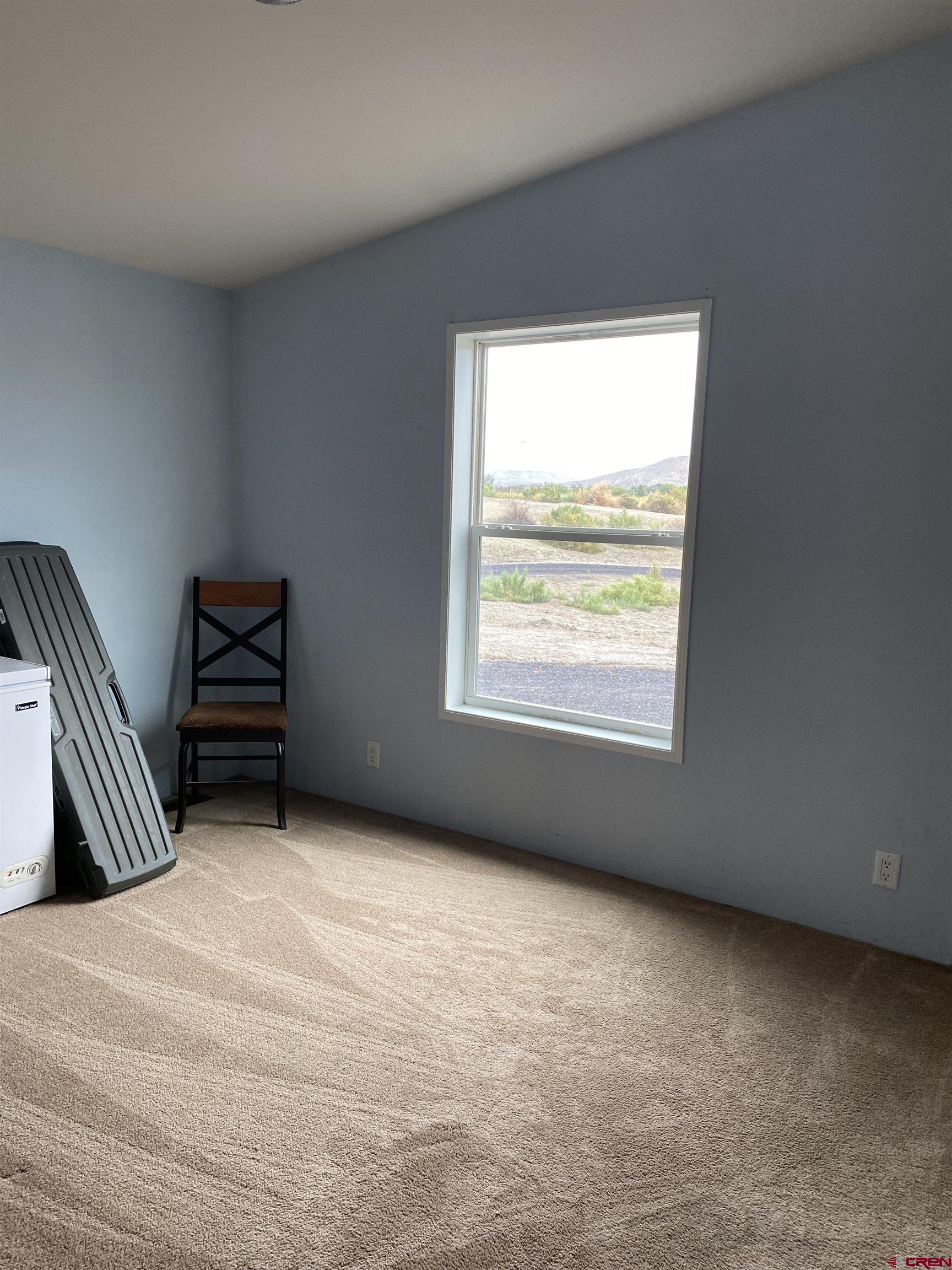 7156 Peach Valley Road Delta, CO 81416 - Photo 28 of 33 a view of an empty room with a window