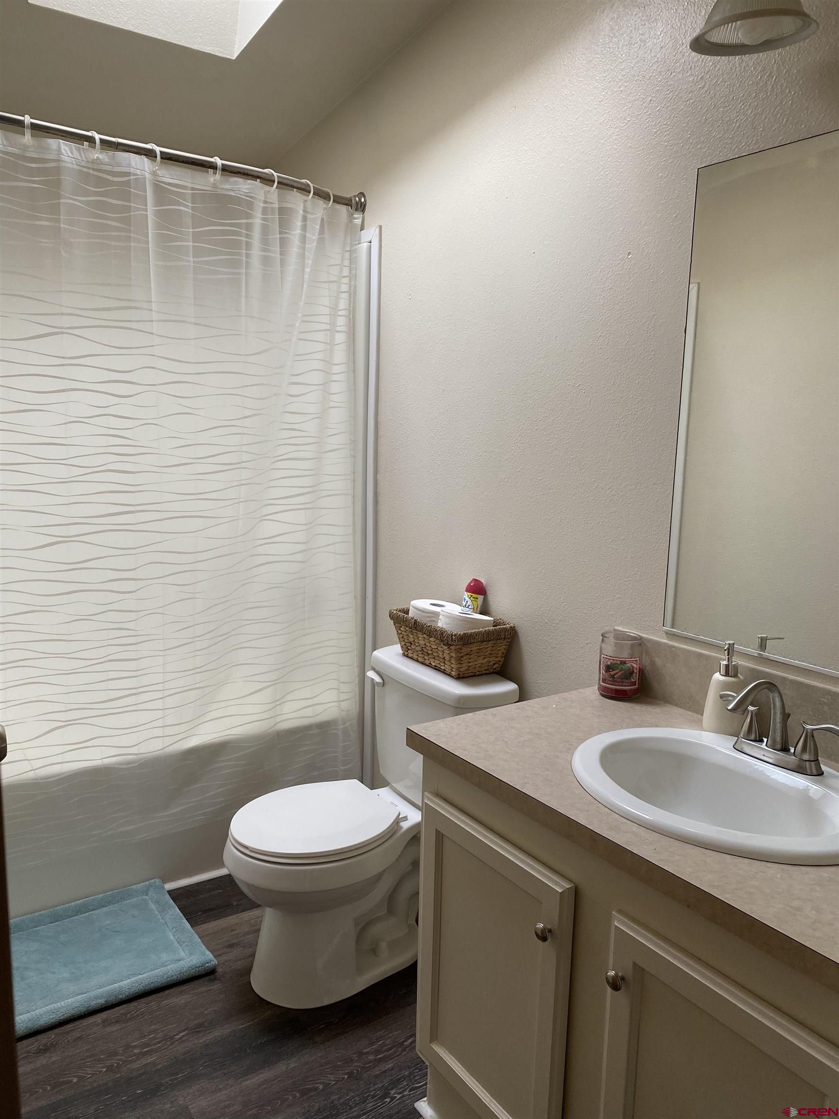 7156 Peach Valley Road Delta, CO 81416 - Photo 29 of 33 a bathroom with a sink a toilet and shower